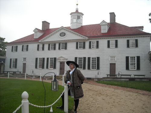 In the circular forecourt to the rear of the house.